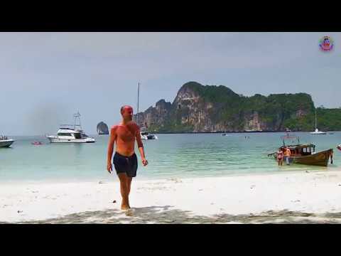Swimming and beach at the monkey beach in Yong Kasem Bay on the west coast of Phi Phi in Thailand