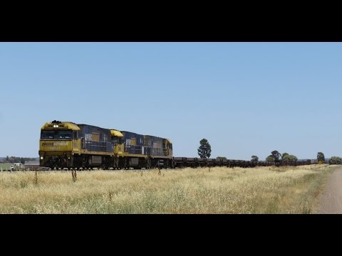 NR21+NR49+NR77 with 7YN2 Whyalla to Newcastle steel train near Parkes, NSW