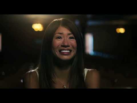 Disney’s Prom (2011) trailer still: Nova Prescott walks past the gym banner as the big night looms