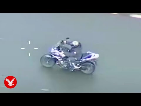 Armed police takedown motorcyclist with tactical contact