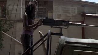 The Walking Dead - Michonne looks at military vehicles in Woodbury