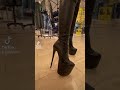 Leather Boots And Wetlook Leggings Walking In Shopping Mall In High Heels