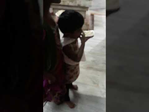 Rasagnya eating prasadam