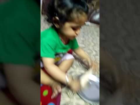 A small cute baby PRATHAM eating ice - cream..... Having fun eating