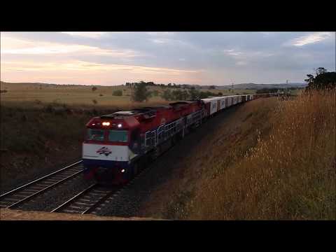 FIE003+FIE002 power along through Athol, NSW bound for Sydney with #8148 from Dubbo.