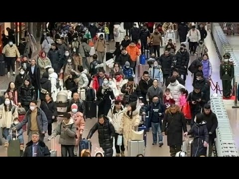 Crowds throng Beijing railway station for Lunar New Year rush | AFP