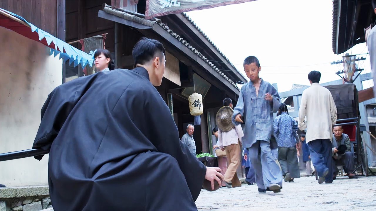 A child bumps into a Japanese samurai and is slashed by a sword master who appears and defeats him.