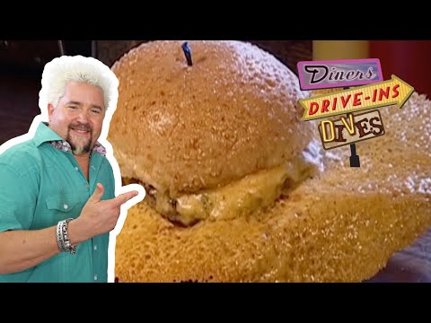 Guy Fieri Eats a Burger with a MASSIVE Cheese Skirt | Diners, Drive-Ins and Dives | Food Network