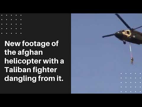 Viral video of a Taliban helicopter flying with a fighter dangling from it.