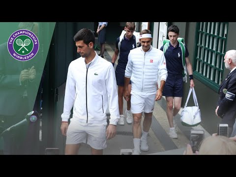 Roger Federer and Novak Djokovic walk onto Centre Court for Wimbledon 2019 Final