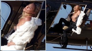 Topless Kate Moss hangs out of helicopter and bares her NIPPLES after losing title of Britain's high