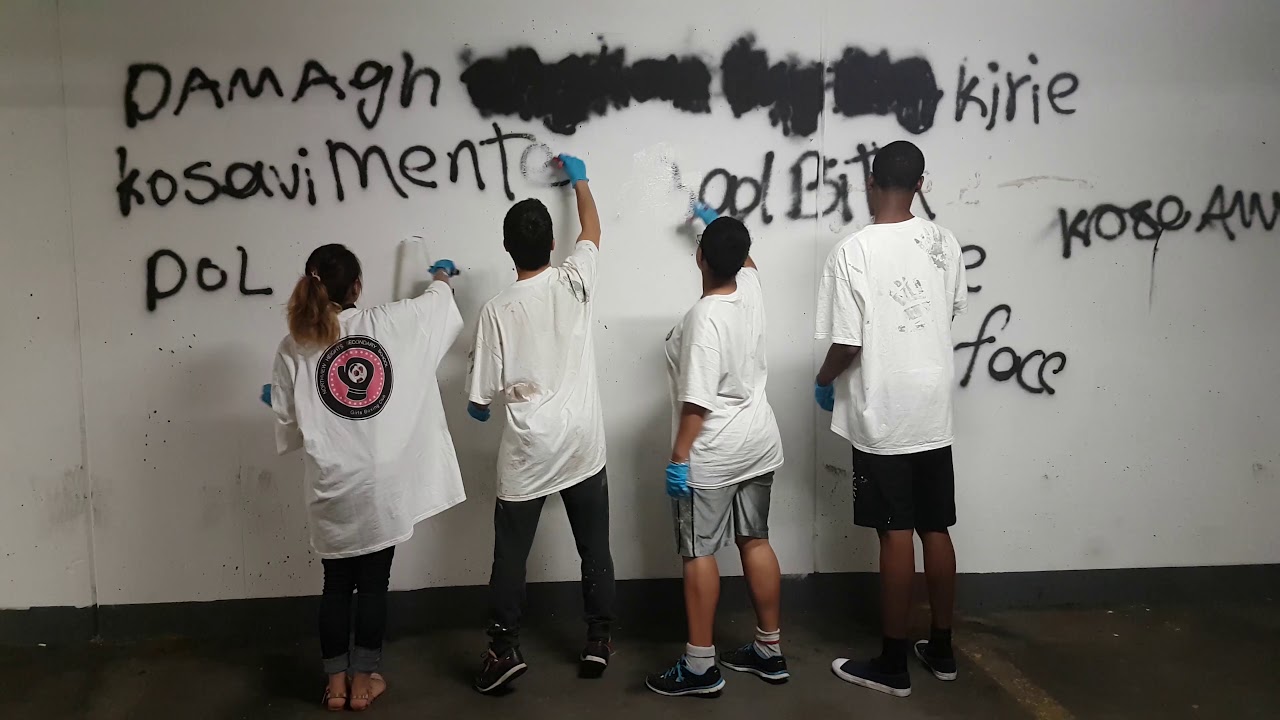 32 Division YIPIs clean up graffiti in their community