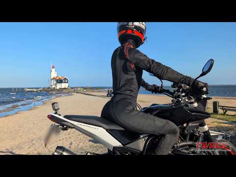 A scenic ride on the Nuda 900 through iconic Netherlands with water, windmills and green fields