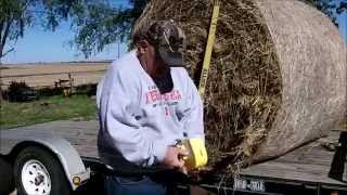 Strapmaster tie down a hay bale, or any flatbed load
