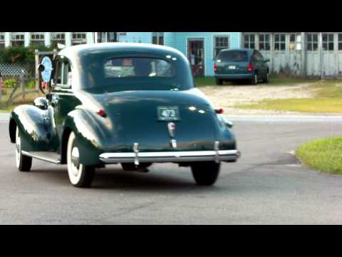 Thumbnail for Classic cars pulling out of 50's diner by classic cars
