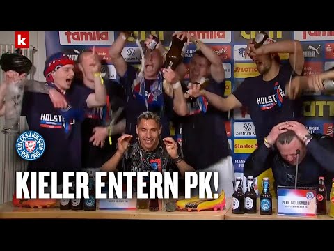 Bierdusche für Holstein-Trainer Rapp: Kieler Mannschaft stürmt die Pressekonferenz