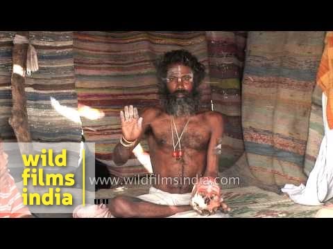 Aghori sadhu applying human ash
