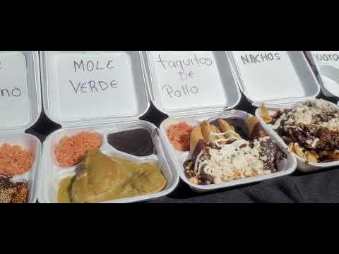 La Feria de los Moles 2023 different Moles and crowd.