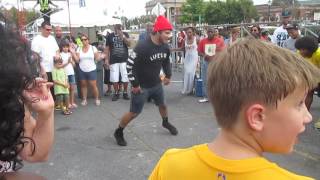 Breakdancing while DJ Grandmaster Flash plays