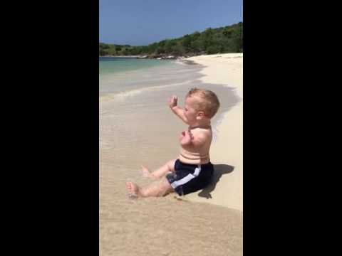 Cute beach baby scared of waves