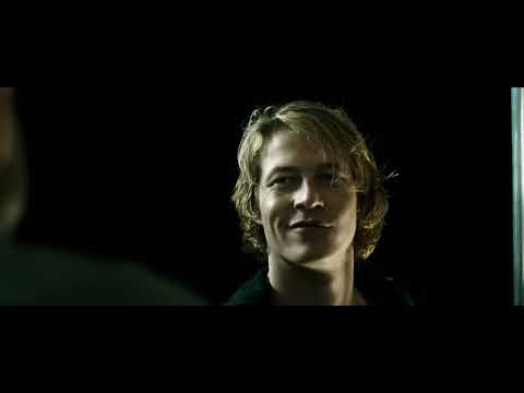 Point Break (2015) official trailer frame of wingsuit flyers diving across a canyon