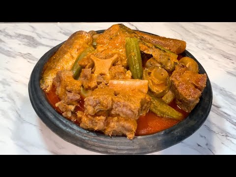 SALTED BEEF AND OXTAIL WITH COW SKIN AND GRILLED MACKEREL LIGHT SOUP WITH FUFU