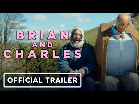 Trailer still: Brian wheels Charles through a rainy Welsh lane