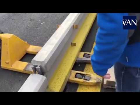 Tsunami Democràtic protesters remove a concrete block on the AP7