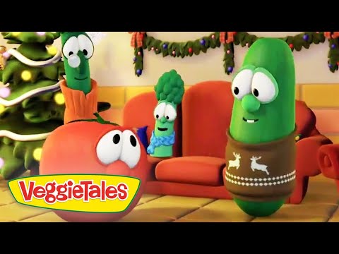 VeggieTales characters in a festively decorated living room with a Christmas tree; a cucumber in a reindeer sweater chats with an orange tomato.