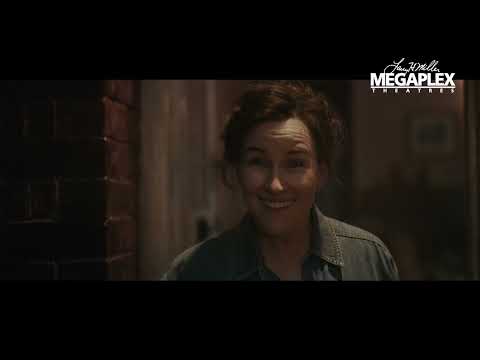 Better Man (2024) official trailer thumbnail: neon stage lights and a simian silhouette with a mic