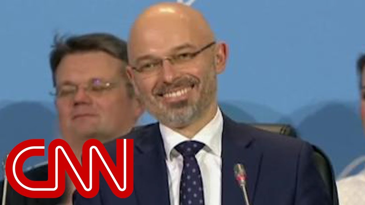 Tense climate talks end in agreement