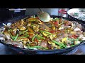 Cooking Spanish Paella With Vegetables And Mushrooms London Street Food