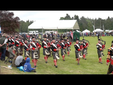 Atholl Highlanders led by Pipe Band arrive for the 2022 Atholl Gathering Highland Games in Scotland