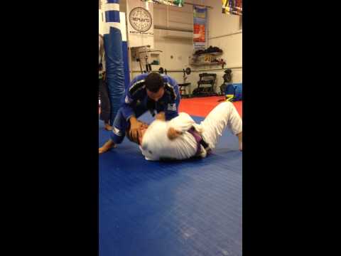 Professor Neto reviews the basic arm-bar from knee on belly position at Carlos Neto BJJ.