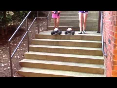 Em, Kate running RC cars down stairs