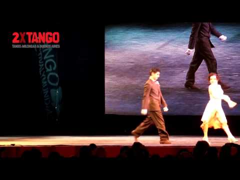  Giovanna Di Vincenzo  and  Sergio Martin Almiron  are  dancing  to  a  milonga