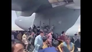 RAW VIDEO: People cling to US planes at Kabul airport
