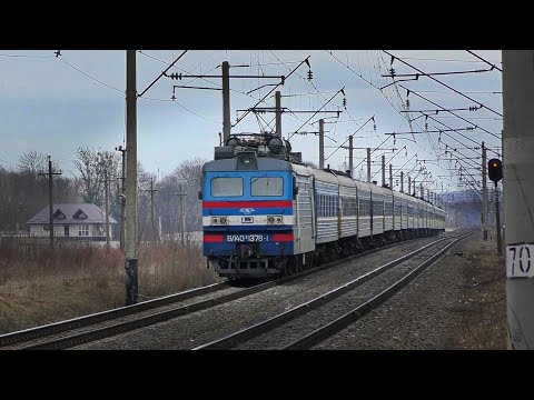 Passenger train raises a cloud of dust at the station