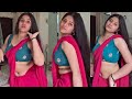 Low Hip Red Chiffon Saree Draping Style Paired With Blue Sleeveless Blouse High Saree Fashion