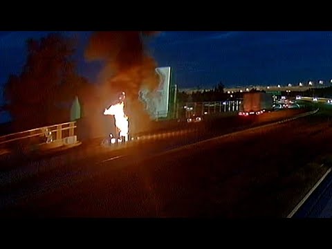 Burning truck at side of the road E67