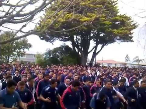 Kelston Boys’ High School perform a massive haka in honour of the new Maori carving on campus.