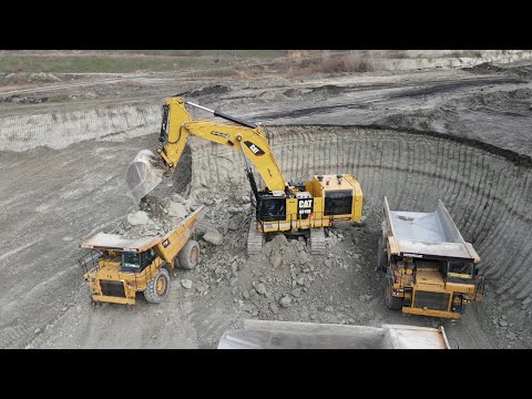 Huge Caterpillar 6015B Excavator Loading Caterpillar Dumpers - Sotiriadis Mining Works