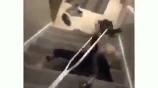 Little girl falls down the stairs with crutches