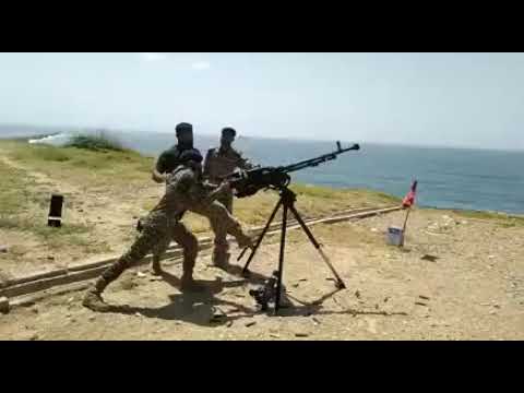 12.7 mm anti aircraft gun firing by marines