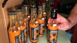 Shrinkwrapping Cruxial Hot Sauce Bottles
