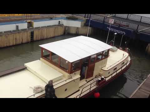 Traditional Dutch barge leaves the lock at Chatham