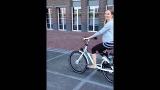 Babe riding bike in Amsterdam