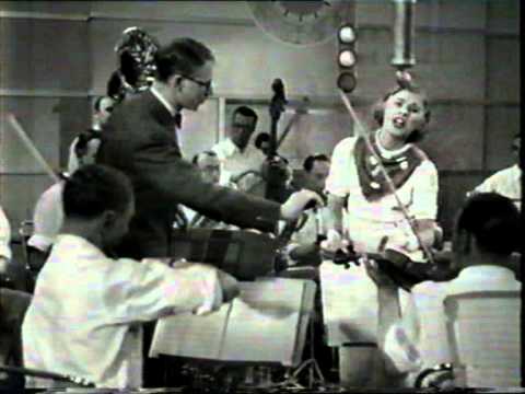 British Band leader Henry Hall plays "Honey-Coloured Moon" vocalist Hildegarde - 1935