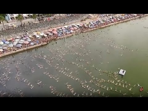 Swimmers float at Argentine Lake for world record attempt - YouTube