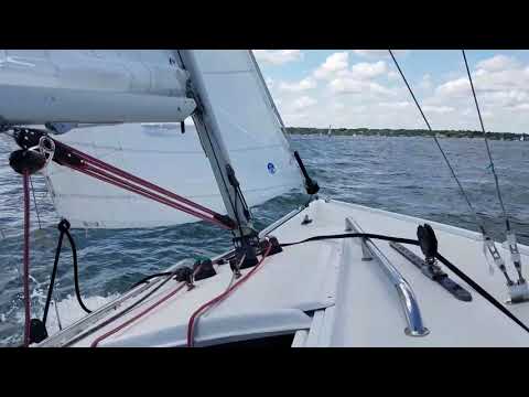 Sailing a J22 in Newport harbor as part of Newports public sailing program
